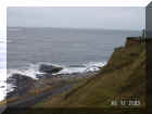 Looking down cliff face.