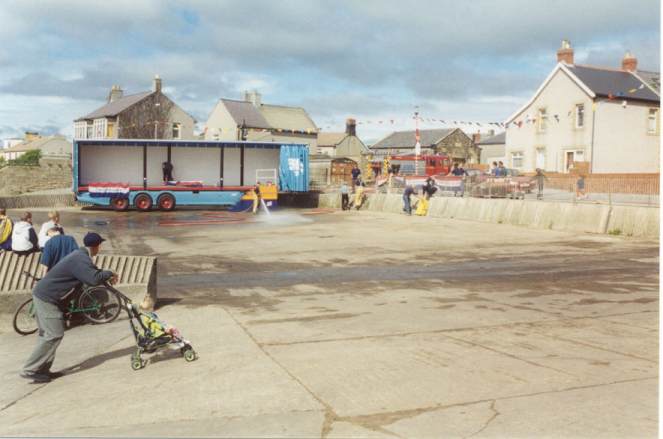 Preparing the area with a hosing down!