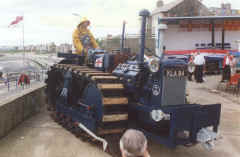 The 'driver' is dressed in period waterproofs of the 1950's.